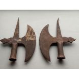 Two old heavy metal axe pike heads.