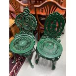 A Lot of two Antique heavy Carron Works cast iron ornate garden chairs. Painted in a bottle green.