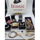 A Collection of vintage and contemporary costume jewellery which includes an Antique brass and blood