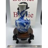 A 19th century Chinese blue and white vase. Together with a Japanese hardwood stand. [Vase 15cm