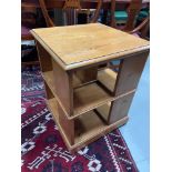 A Reproduction pine revolving bookcase.