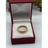 A Gents 18ct gold wedding band. [Ring size R] [Weighs 3.60Grams]