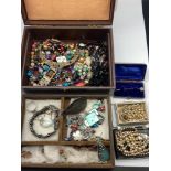 A Jewel box containing a quantity of vintage jewellery to include Pearl necklaces, Miracle celtic