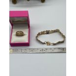 A Ladies 9ct gold gate bracelet and a 9ct gold and diamond ring [Ring size 0 1/2] [8.31Grams]