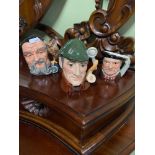 A Lot of three miniature Royal Doulton Toby Jugs which includes Merlin.