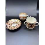 A Lot of three 19th century Derby porcelain items. Includes Three handle loving cup, Tea cup and