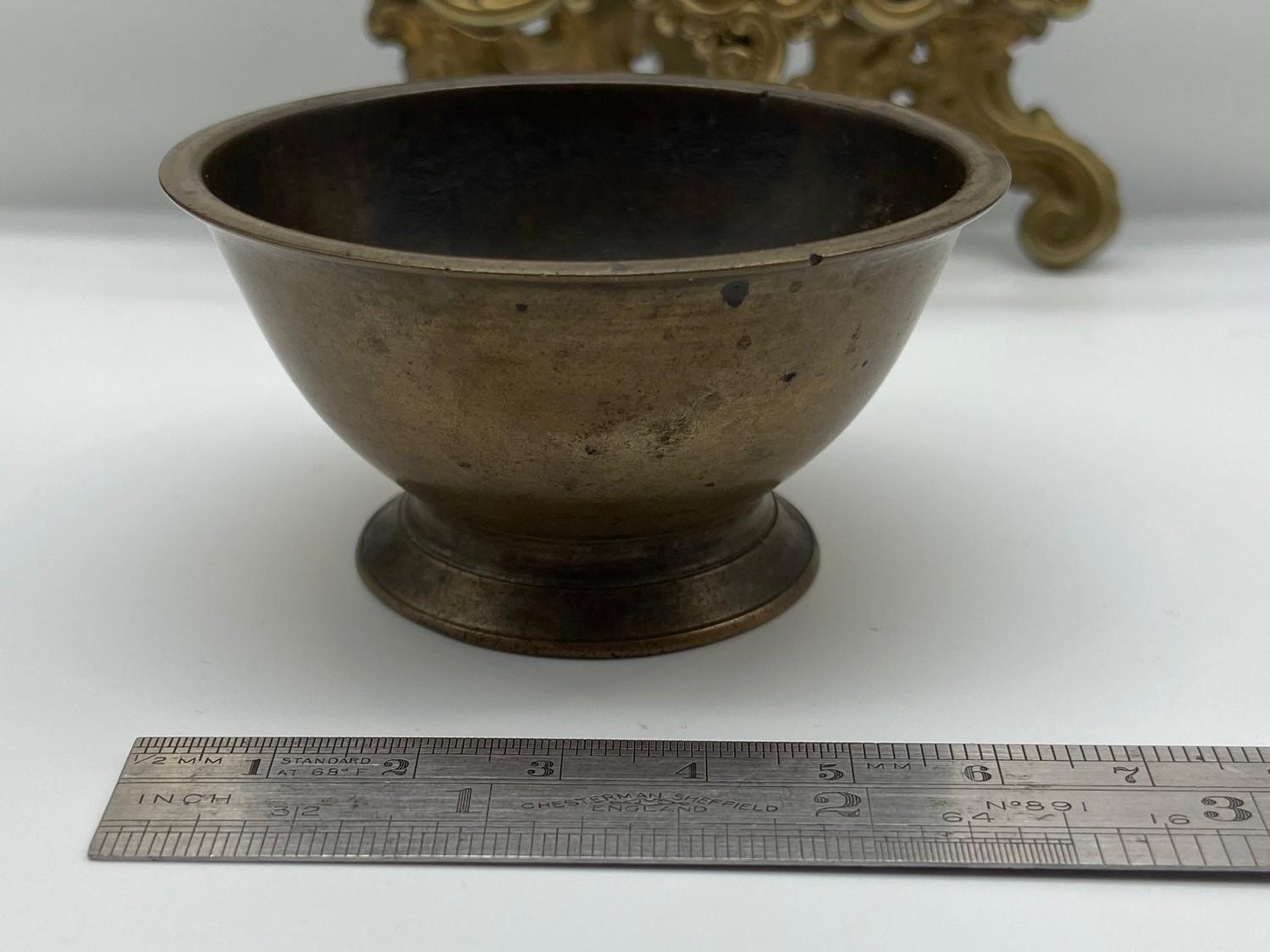 A 19th century [possibly earlier] Chinese bronze drinking cup. [3.5cm height, 6.7cm diameter]