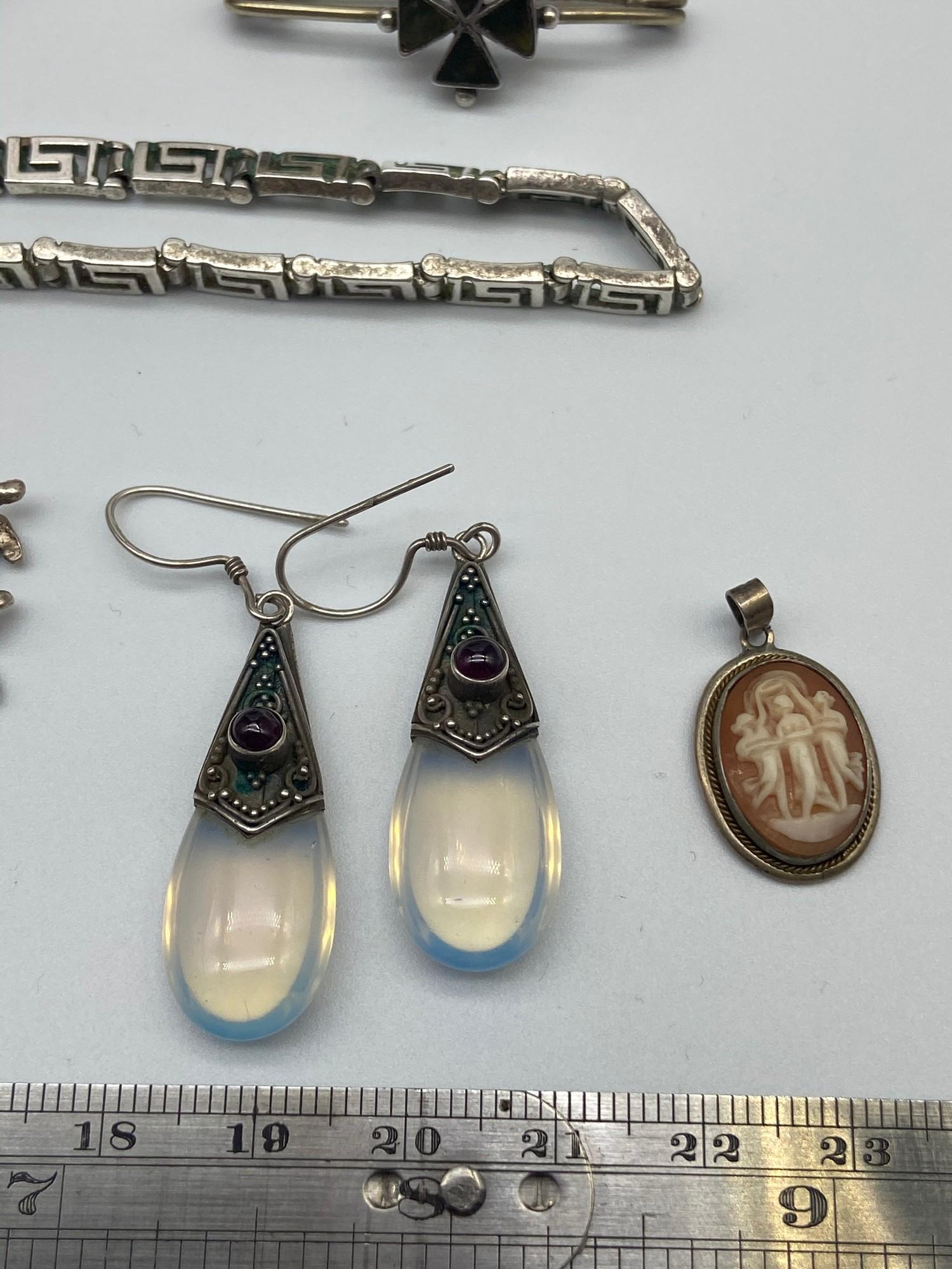 A Quantity of silver jewellery which includes moonstone and silver earrings, Silver charm - Image 2 of 6