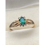 A 10ct gold and single Emerald stone ring. [Size N]