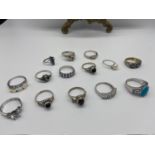 A Lot of 14 silver ladies dress rings designed with various gem stones.