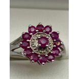 A Lovely example of a ladies 925 silver, Ruby and diamond dress ring. [Ring size O]