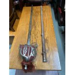 Antique officer cavalry sword and scabbard. Designed with ornate etched blade.