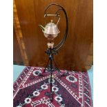 An original Arts and Crafts cast iron burner and tea pot stand in the manner of W.A.S Benson.