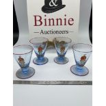 A Set of four antique blue drinking glasses, Detailed with hand painted red trims, Gentleman holding