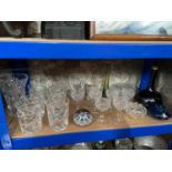 A Shelf containing a quantity of fine crystal and art glass. Includes Mdina vase, Whisky onion