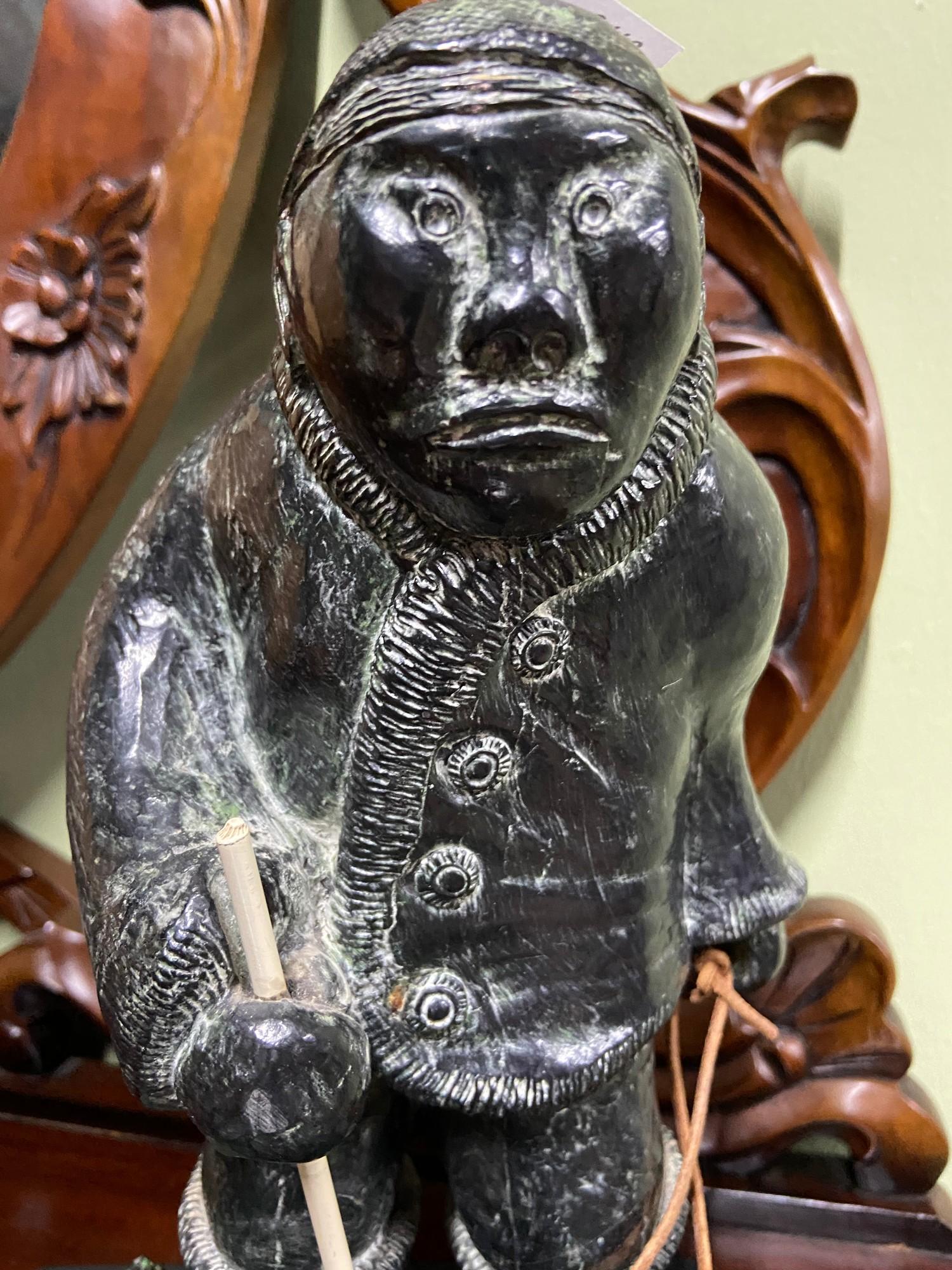 A hand carved stone Eskimo figure and two seals. - Image 3 of 5