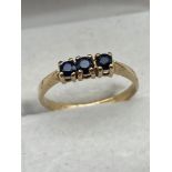A Ladies 9ct gold ring set with three CZ stones. Ring size L, Weighs 1.37grams.