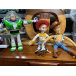 Three Disney Toys story figures, Buzz, Woody and Jessie.
