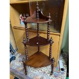 A Victorian three tier What Not corner stand. Designed with bobble effect supports and on original