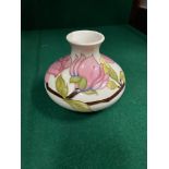 A Moorcroft Bulbous Hibiscus tube line vase. [10.5cm in height, 13cm in diameter]