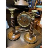 An oak cased mantel clock together with a pair of Barley twist and brass topped candle sticks.