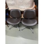 A Pair of Orangebox track & swivel work/lounge chairs. designed in black/ dark brown leather.
