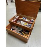 A Mid century teak cantilever sewing box containing a large quantity of threads and sewing tools