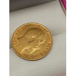 A Gold 1906 Half sovereign coin.