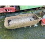 A Heavy stone trough style planter.