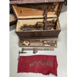 Antique Joiners tool chest containing a selection of wooden planes, clamp and saw etc