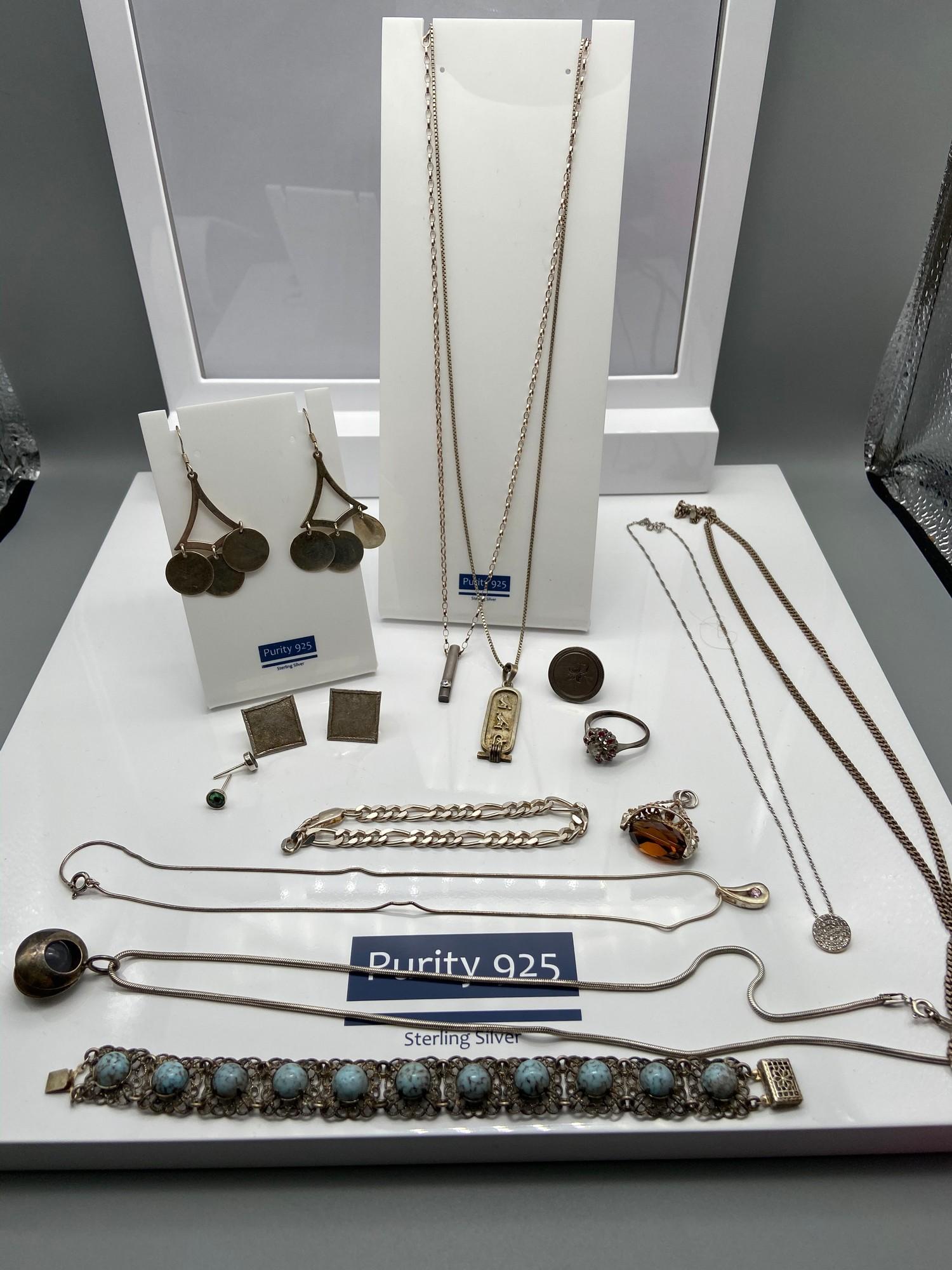 A Quantity of various silver jewellery which includes silver and brown stone swivel fob, Egyptian