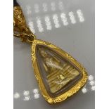 A Possible 24ct gold filled Thai Buddha amulet pendant with a wood and gold necklace.