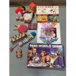 A Selection of vintage board games and loose toys to include two plush wombles