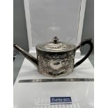 A Georgian London Silver ornate tea pot. Designed with a horn handle. Maker - George Burrows (I)