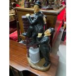 A Large Laurel and Hardy porcelain figurine. [A/F] [50cm in height]