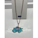 Edinburgh silver and enamel flower pendant together with a silver chain. Produced by Alistair Norman