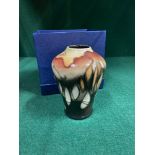 A Small Moorcroft Tube line vase. Dated 2005. Comes with a box. [10.5cm in height]
