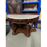 A Victorian Mahogany and Marble top half moon console table.