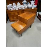 A Retro teak slipper/ sewing box with two drawers. Designed on four pedestal legs.