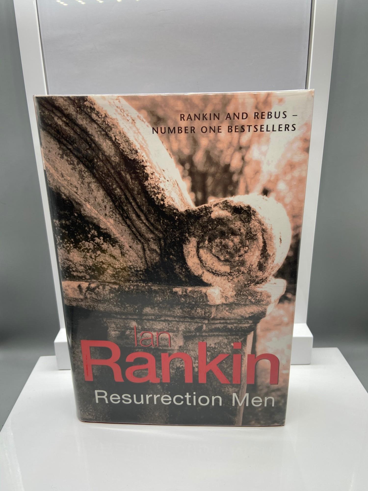 A Signed book by Ian Rankin titled Resurrection Men. Signed in pen and Gallows doodle drawing by the