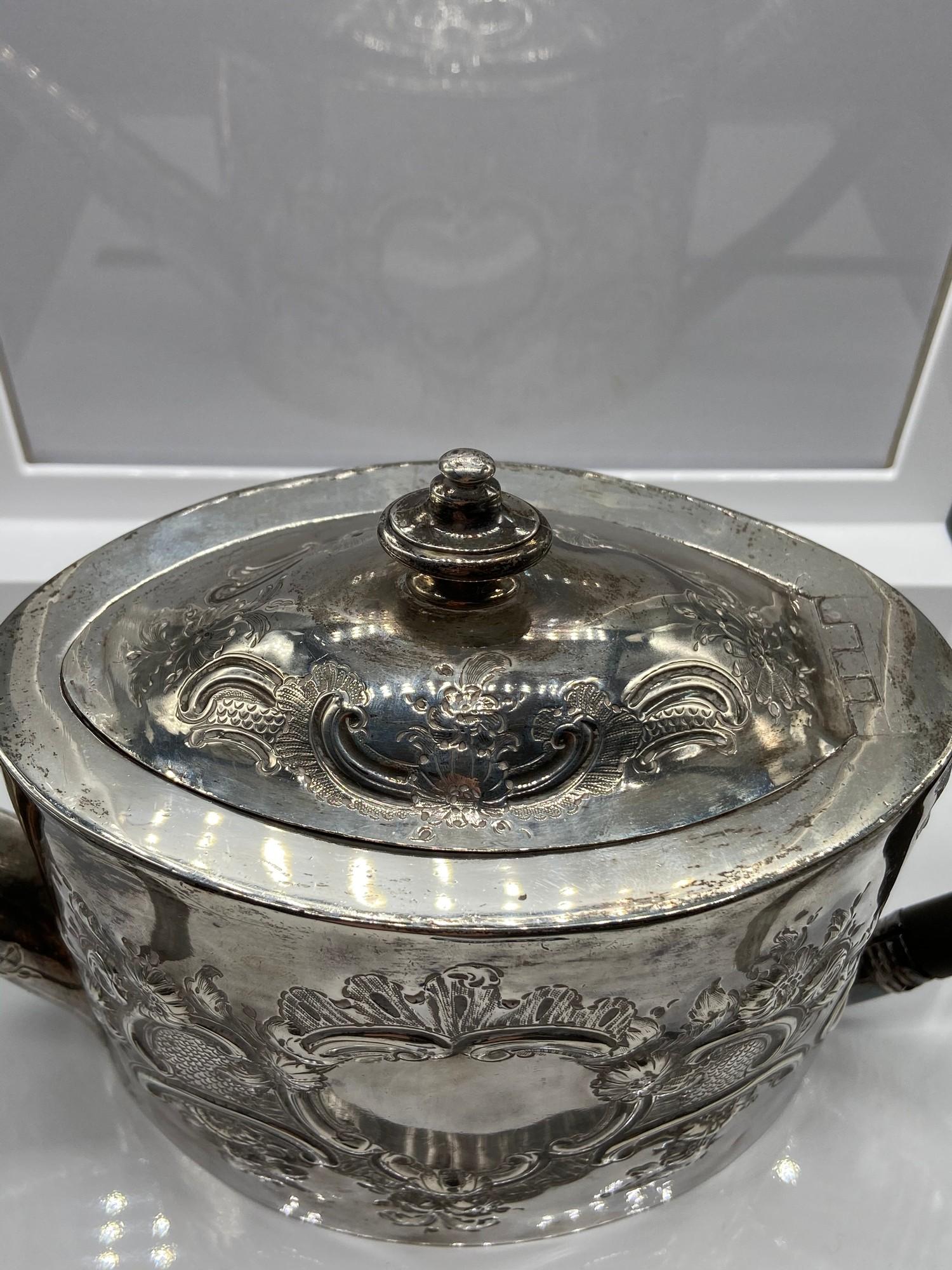 A Georgian London Silver ornate tea pot. Designed with a horn handle. Maker - George Burrows (I) - Image 4 of 7