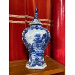 A Large antique Delft blue and white tin glaze urn with lid. Designed with hand painted dancing