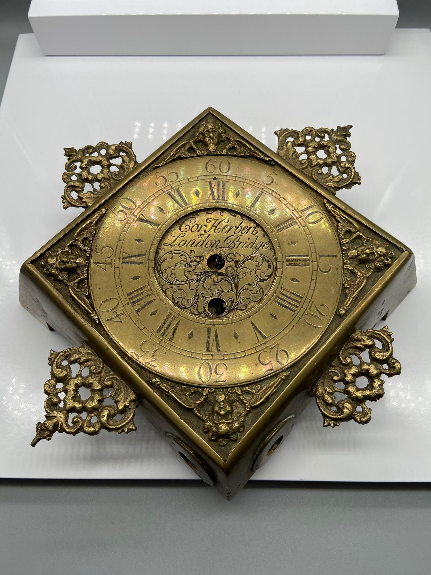 Antique brass wall clock engraved 'Cor Herbert London Bridge' Designed with a French clock movement.