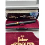 A Vintage Fisher Space Pen, Matt black bullet design and fitted with a gilt metal space shuttle,