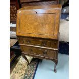 Bur walnut ladies writing bureau designed with queen anne legs.