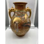 A Japanese Satsuma hand painted urn vase, Designed with various figures and dragon, Signed to the
