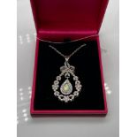 A Beautiful example of a ladies 925 silver, cz and pear shaped opal pendant with necklace.