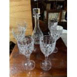 A Royal Doulton cut crystal decanter together with 6 matching wine glasses.
