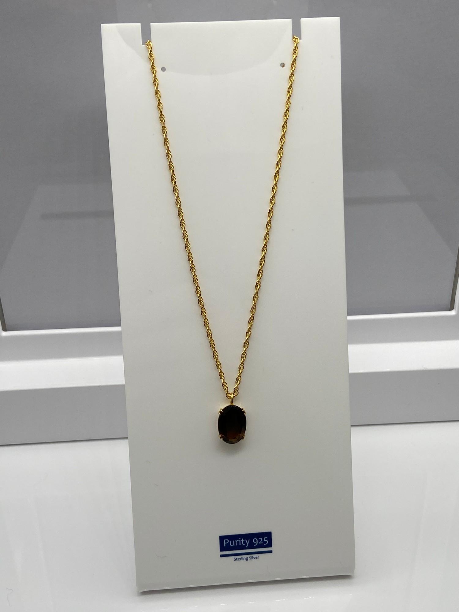 A Ladies 9ct gold necklace together with a 9ct gold and Smokey Quartz stone pendant. [Chain 45cm