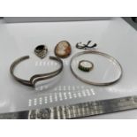 A Quantity of 925 silver jewellery which includes Love, Life, Laugh bangle, 925 gilt silver and